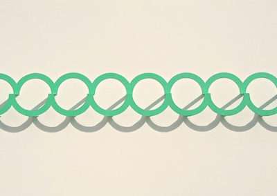 A series of overlapping green circles aligned in a neat, horizontal row on a light beige background. the overlapping design creates a sense of continuous connection.