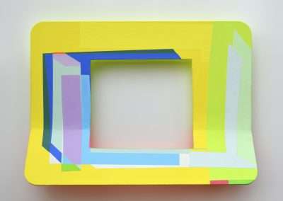 Abstract painting featuring overlapping squares and rectangles in bright shades of yellow, blue, and green on a light background, creating a three-dimensional illusion.