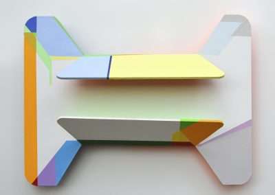 A modern, artistic shelf resembling an airplane, featuring soft pastel colors and angular, geometric shapes on a white wall background.