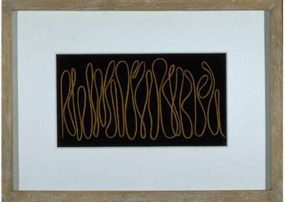 A framed piece of art inspired by Frederick Hammersley, featuring an abstract design with a series of interconnected, looping lines in a coppery color against a black background. The frame is rustic wood, and there is a white mat surrounding the artwork.