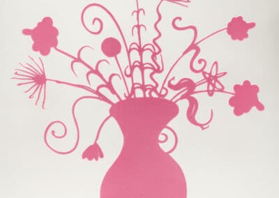 A sculpture of an abstract pink flower bouquet in a vase, reminiscent of Kenny Scharf's playful style. The flowers and stems are simple, with smooth, flowing shapes and whimsical designs, arranged to look like they are made from cut-out material. The vase sits on a reflective surface.